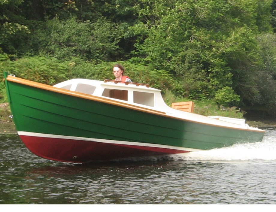Classic 22' wooden power boat at speed, custom built in Cork Ireland by Roeboats