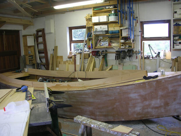 Finishing coaming on catbird 16 foot wooden sharpie dayboat lugsail built by Roeboats West Cork Ireland for sale
