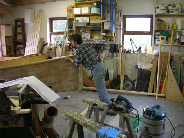 16 foot sharpie wooden boat moving outside