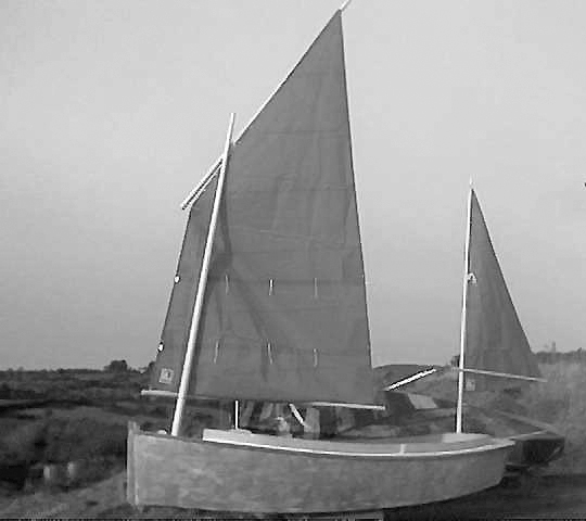 Catbird sharpie yawl test rigged with sails